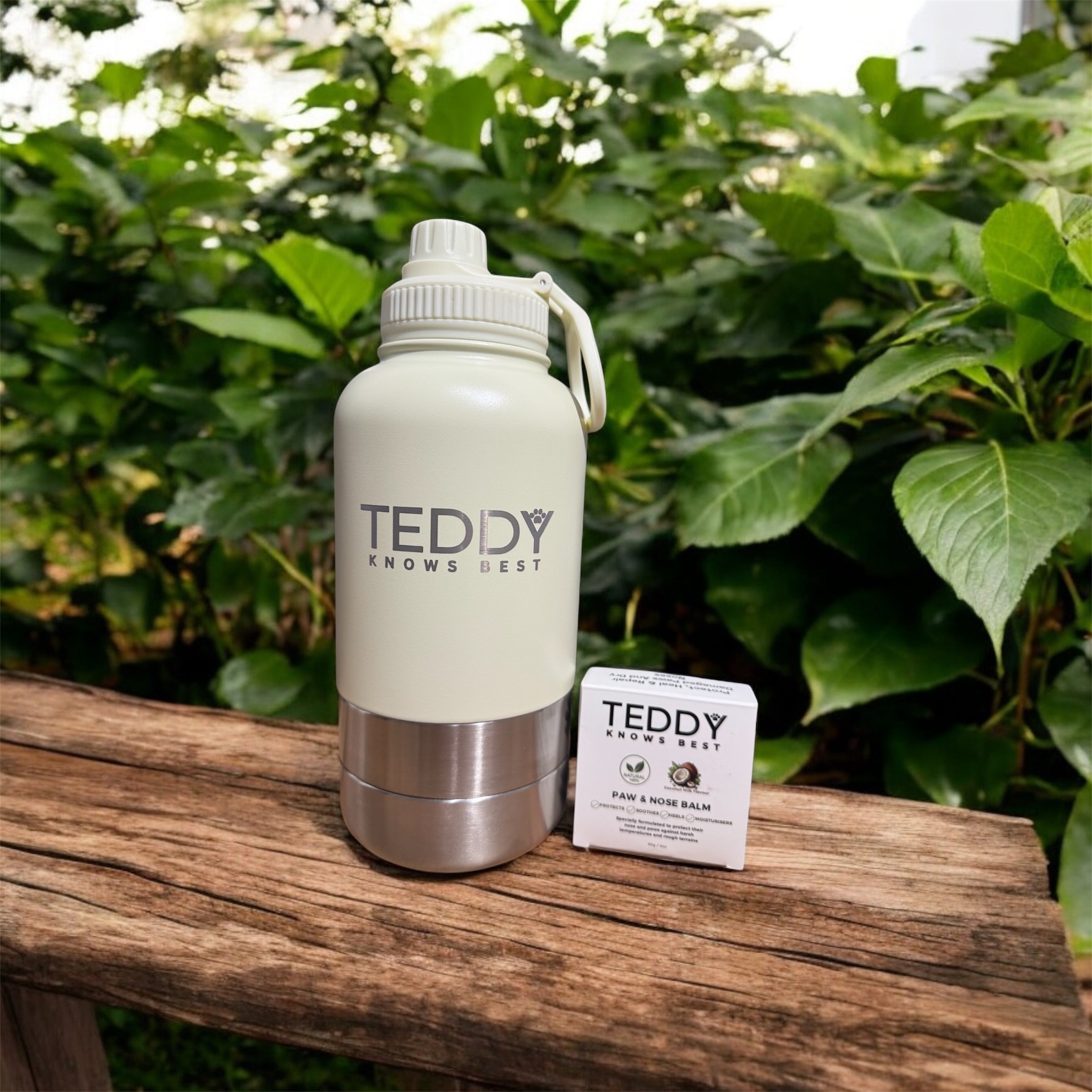 white 3 in 1 portable water bottle  and the Teddy Knows Best paw and nose balm for dogs